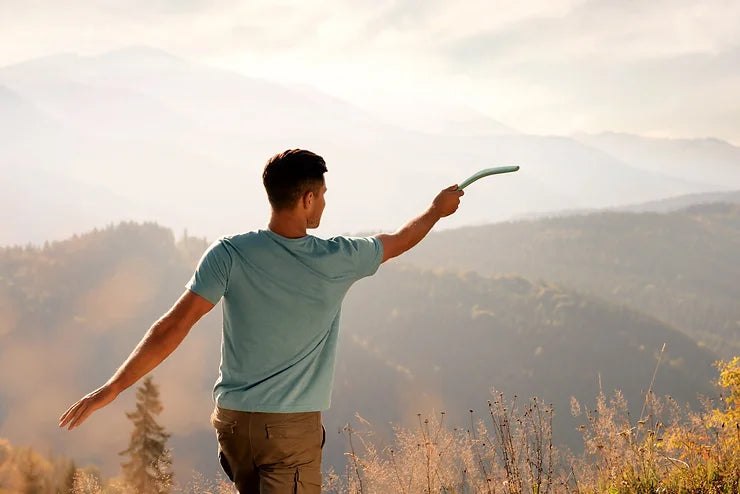 a man throwing a boomerang