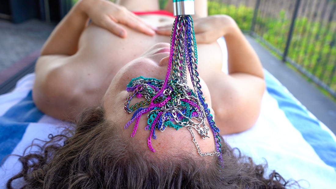A woman experiencing pleasure through sensation tools